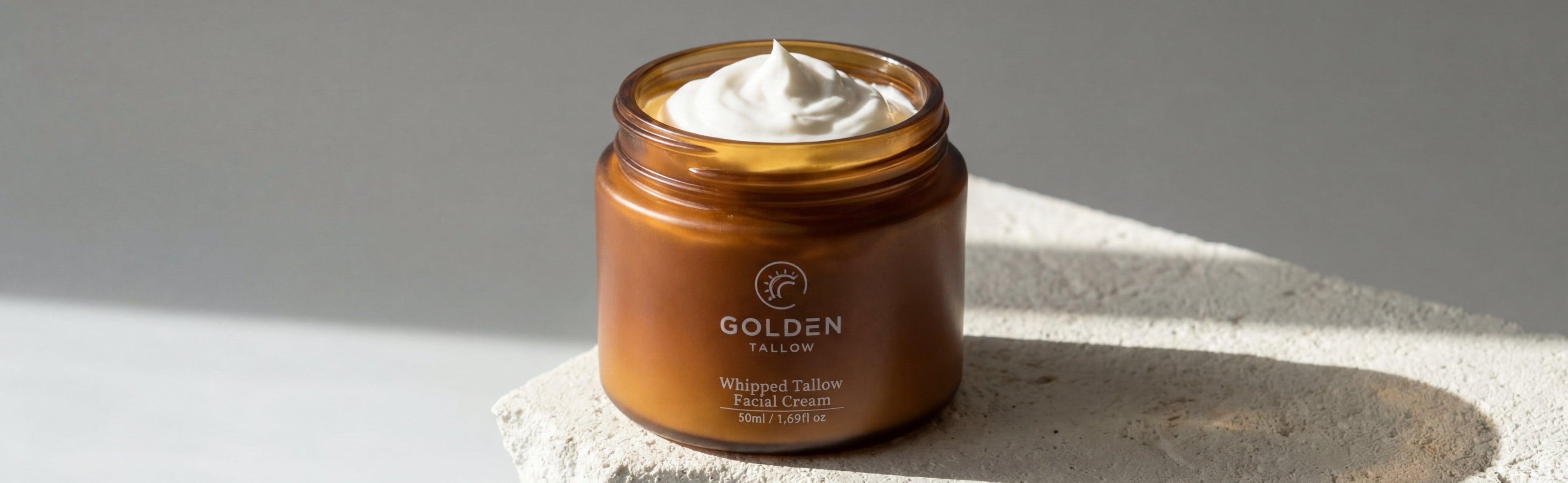 Jar of cream with a visible brand name on a textured surface